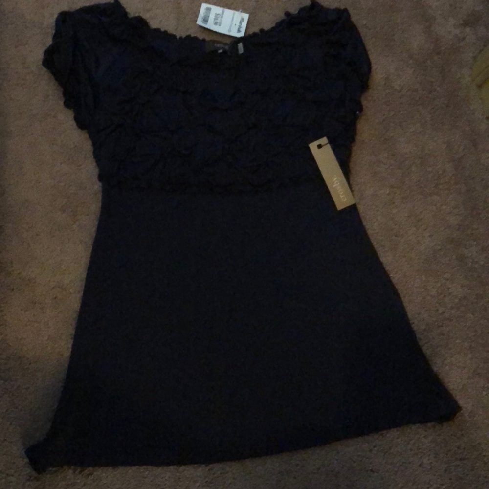 Blue shirt sleeve shirt. Puckered too area. New